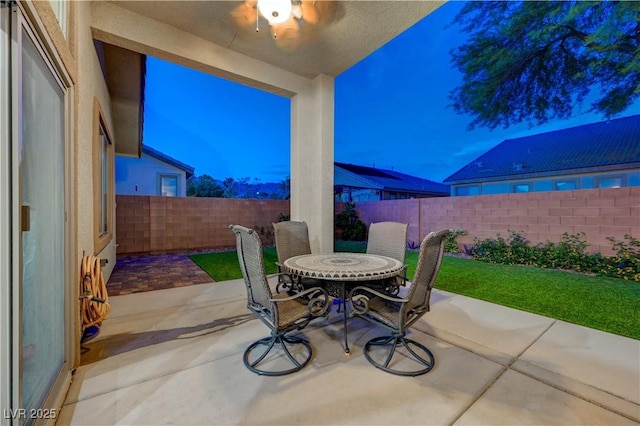 8128 Devils Canyon St, North Las Vegas, NV 89085 - fenced backyard featuring a patio area and outdoor dining space