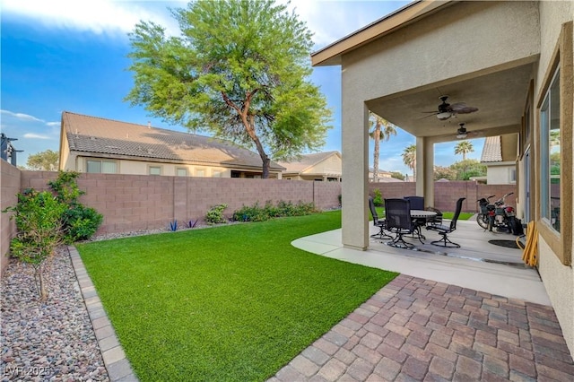 8128 Devils Canyon St, North Las Vegas, NV 89085 - view of yard with a ceiling fan and a patio area