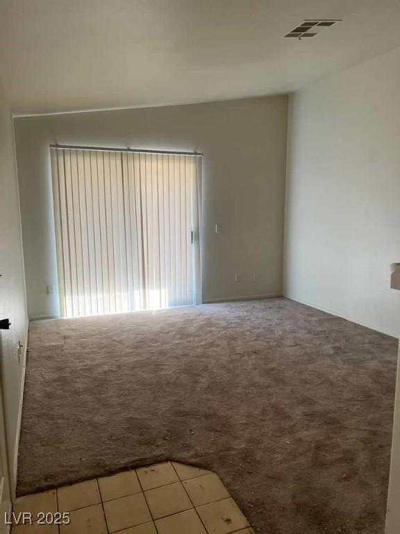 2110 Los Feliz St Unit 2037, Las Vegas, NV 89156 - tiled empty room featuring carpet
