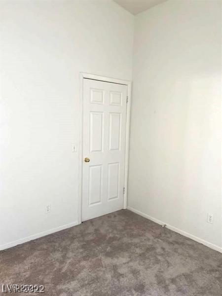 2110 Los Feliz St Unit 2037, Las Vegas, NV 89156 - empty room featuring carpet floors and baseboards
