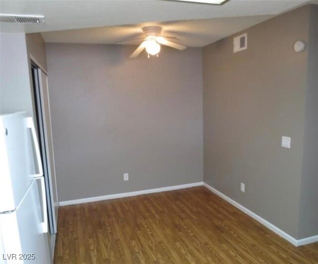 574 Roxella Ln Unit C, Las Vegas, NV 89110 - spare room featuring wood finished floors, baseboards, a ceiling fan, and a smoke detector