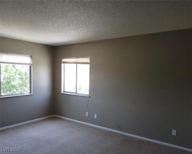 574 Roxella Ln Unit C, Las Vegas, NV 89110 - carpeted spare room featuring a textured ceiling and baseboards