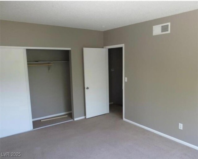 574 Roxella Ln Unit C, Las Vegas, NV 89110 - unfurnished bedroom featuring carpet floors, a closet, and baseboards