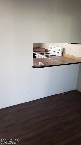 4770 Topaz St Unit 79, Las Vegas, NV 89121 - kitchen view of white electric stove and dark wood-type flooring