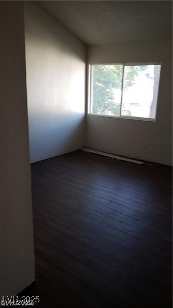 4770 Topaz St Unit 79, Las Vegas, NV 89121 - spare room featuring wood finished floors