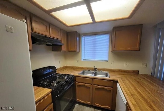 854 Stainglass Ln, Las Vegas, NV 89110 - kitchen featuring white appliances, under cabinet range hood, a sink, and butcher block countertops