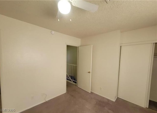854 Stainglass Ln, Las Vegas, NV 89110 - unfurnished bedroom featuring a textured ceiling, a closet, carpet, a ceiling fan, and baseboards