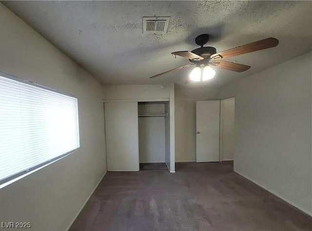 854 Stainglass Ln, Las Vegas, NV 89110 - unfurnished bedroom featuring a closet, baseboards, a ceiling fan, and a textured ceiling