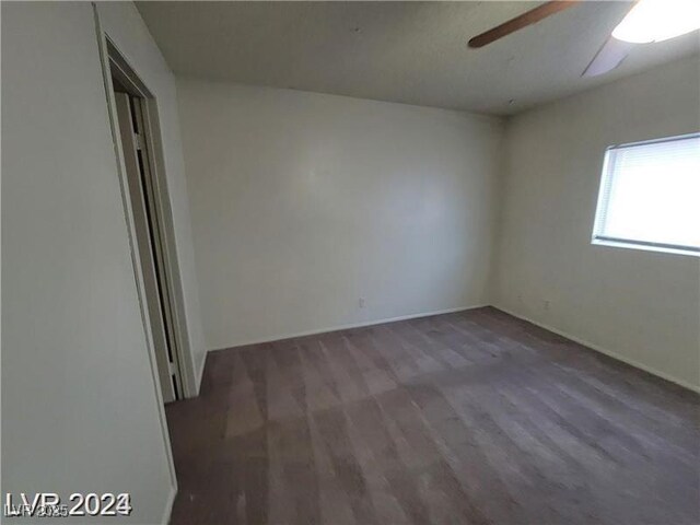 854 Stainglass Ln, Las Vegas, NV 89110 - empty room featuring ceiling fan, wood finished floors, and baseboards