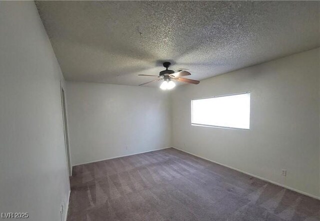 854 Stainglass Ln, Las Vegas, NV 89110 - spare room featuring carpet flooring, a ceiling fan, a textured ceiling, and baseboards