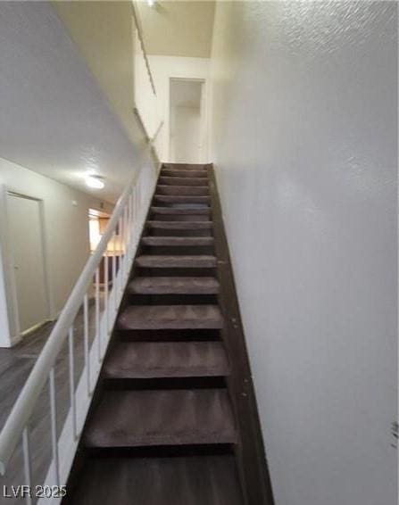 854 Stainglass Ln, Las Vegas, NV 89110 - stairs featuring wood finished floors