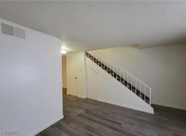 854 Stainglass Ln, Las Vegas, NV 89110 - unfurnished living room with wood finished floors and baseboards