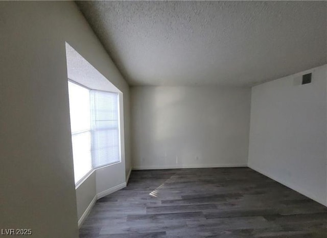854 Stainglass Ln, Las Vegas, NV 89110 - unfurnished room featuring a textured ceiling, wood finished floors, and baseboards