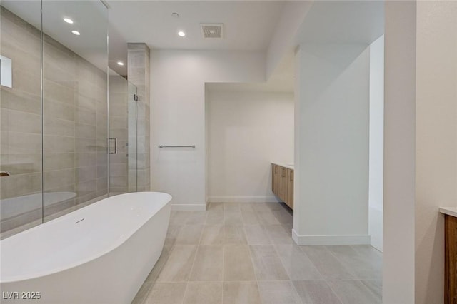 1600 Pleasant Bay Ct, Henderson, NV 89011 - full bathroom with vanity, a freestanding bath, a shower stall, recessed lighting, and baseboards