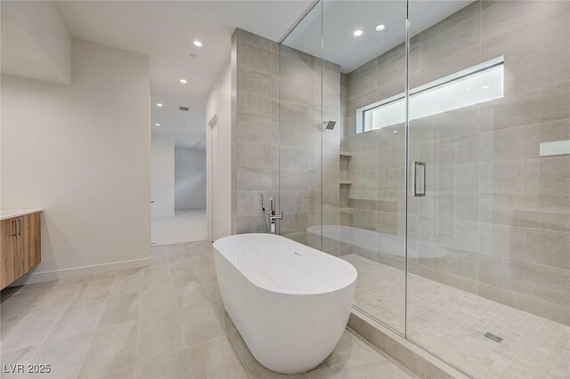 1600 Pleasant Bay Ct, Henderson, NV 89011 - bathroom with a soaking tub, a shower stall, vanity, recessed lighting, and tile patterned flooring