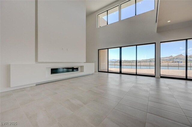 1600 Pleasant Bay Ct, Henderson, NV 89011 - unfurnished living room with a towering ceiling