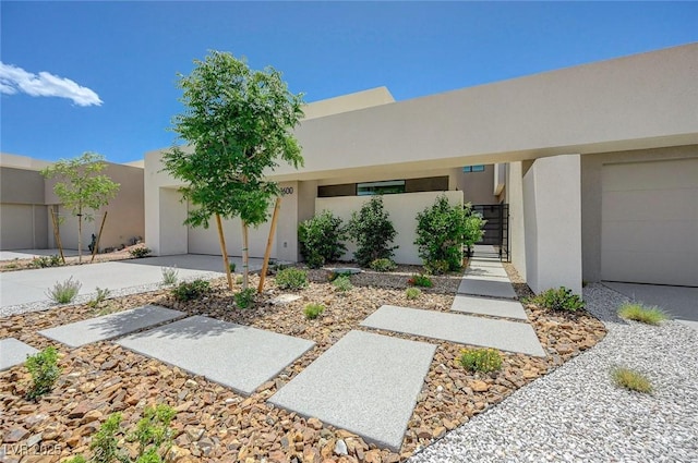 1600 Pleasant Bay Ct, Henderson, NV 89011 - view of front of house with stucco siding, a garage, concrete driveway, and a gate