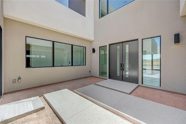 1600 Pleasant Bay Ct, Henderson, NV 89011 - doorway to property featuring stucco siding, a patio area, and french doors