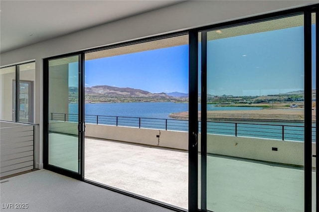 1600 Pleasant Bay Ct, Henderson, NV 89011 - doorway to outside featuring a water and mountain view and carpet flooring