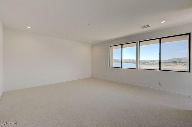 1600 Pleasant Bay Ct, Henderson, NV 89011 - spare room featuring light colored carpet, recessed lighting, and baseboards