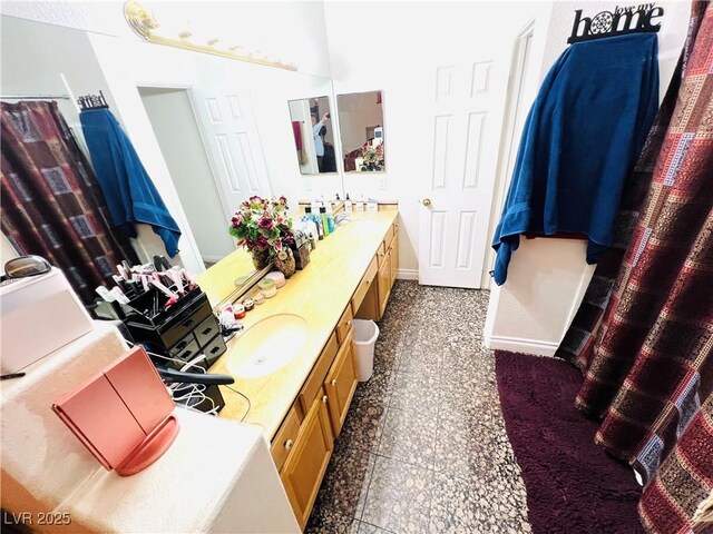 1860 Banaba Ln, Las Vegas, NV 89156 - bathroom with double vanity, baseboards, and granite floors