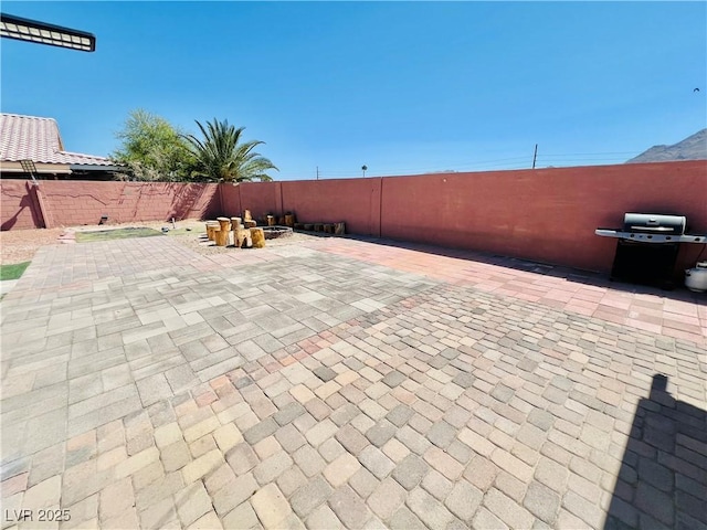 1860 Banaba Ln, Las Vegas, NV 89156 - fenced backyard with a patio and grilling area