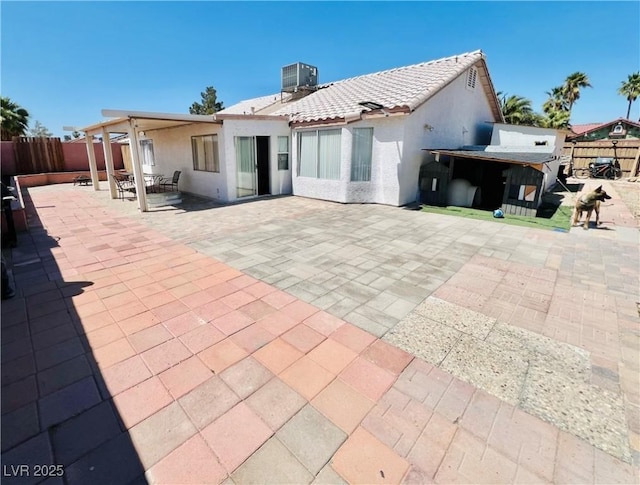 1860 Banaba Ln, Las Vegas, NV 89156 - back of property featuring a patio area, stucco siding, and central air condition unit