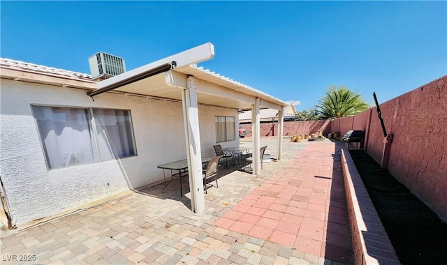 1860 Banaba Ln, Las Vegas, NV 89156 - fenced backyard featuring a patio area and outdoor dining area
