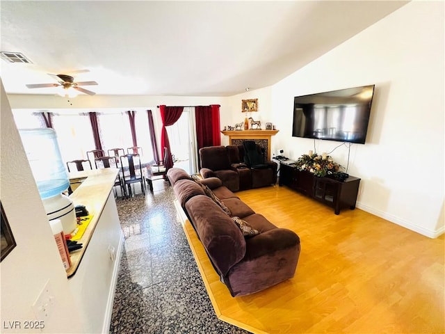 1860 Banaba Ln, Las Vegas, NV 89156 - living room with a ceiling fan, baseboards, a fireplace, and lofted ceiling