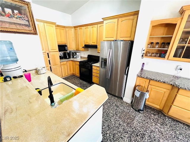 1860 Banaba Ln, Las Vegas, NV 89156 - kitchen featuring black appliances, vaulted ceiling, a sink, under cabinet range hood, and light stone counters