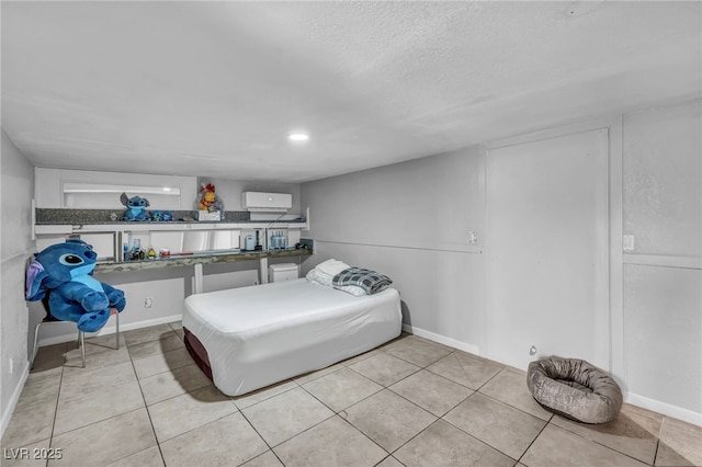 54 Del Amo Dr, Las Vegas, NV 89110 - tiled bedroom featuring a textured ceiling and baseboards
