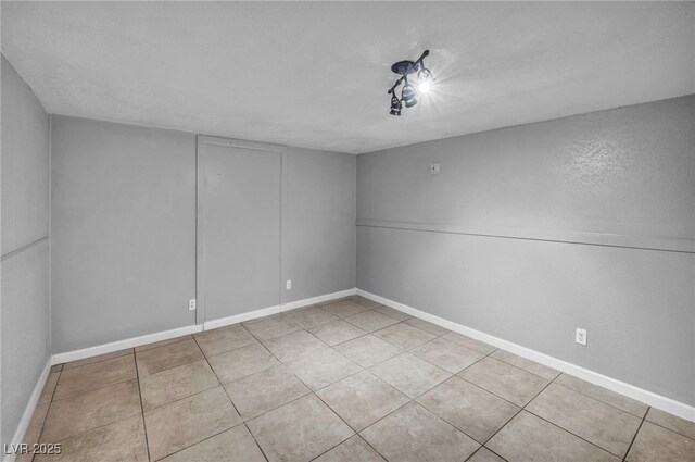 54 Del Amo Dr, Las Vegas, NV 89110 - empty room with light tile patterned flooring and baseboards