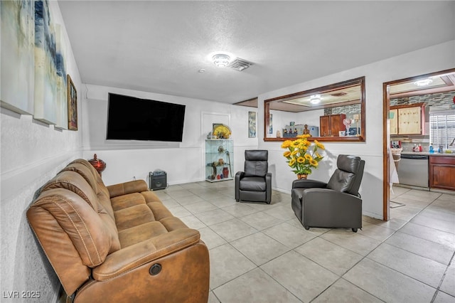 54 Del Amo Dr, Las Vegas, NV 89110 - living room featuring light tile patterned floors and a textured ceiling