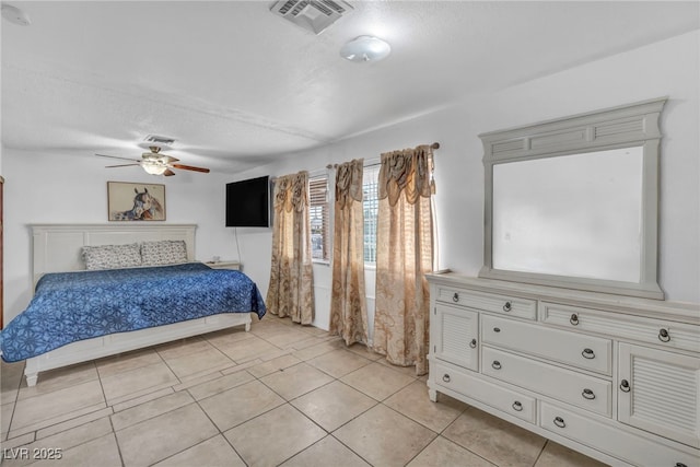 54 Del Amo Dr, Las Vegas, NV 89110 - bedroom featuring a textured ceiling, light tile patterned floors, and ceiling fan