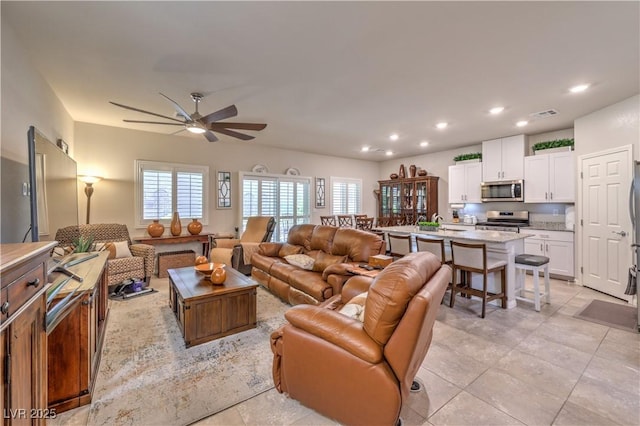 9229 Brayden Bay St, Las Vegas, NV 89178 - living area with ceiling fan, healthy amount of natural light, and recessed lighting