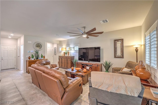9229 Brayden Bay St, Las Vegas, NV 89178 - living room with ceiling fan and light tile patterned flooring