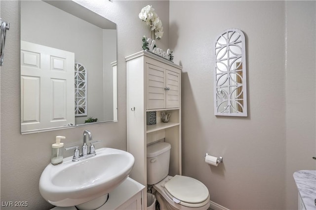 9229 Brayden Bay St, Las Vegas, NV 89178 - half bathroom with a sink and toilet