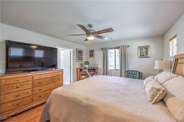 9229 Brayden Bay St, Las Vegas, NV 89178 - bedroom with ceiling fan and wood finished floors