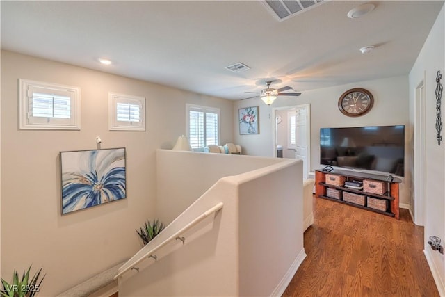 9229 Brayden Bay St, Las Vegas, NV 89178 - hallway with an upstairs landing, wood finished floors, recessed lighting, and baseboards