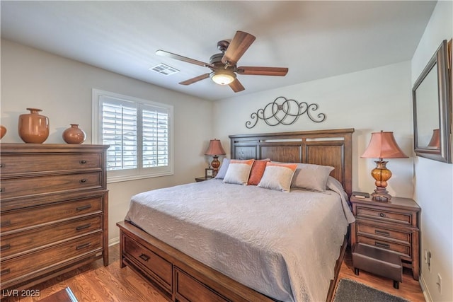 9229 Brayden Bay St, Las Vegas, NV 89178 - bedroom with wood finished floors, baseboards, and a ceiling fan