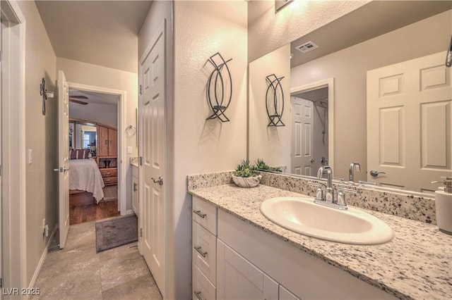 9229 Brayden Bay St, Las Vegas, NV 89178 - ensuite bathroom featuring vanity and baseboards
