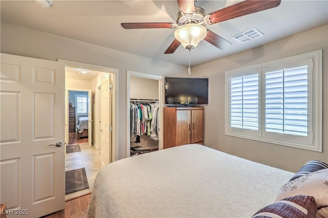9229 Brayden Bay St, Las Vegas, NV 89178 - bedroom featuring a closet, a walk in closet, and ceiling fan