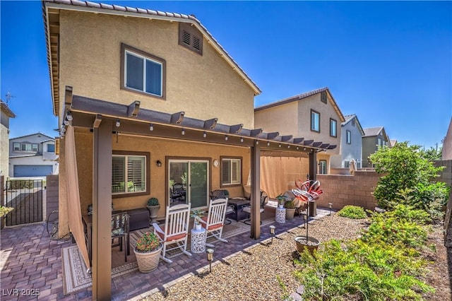 9229 Brayden Bay St, Las Vegas, NV 89178 - rear view of house with outdoor lounge area, a pergola, stucco siding, and a patio