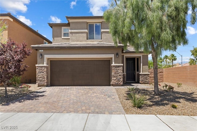 6783 Pleasant Flower St, Las Vegas, NV 89149 - view of front facade with stone siding, stucco siding, and an attached garage