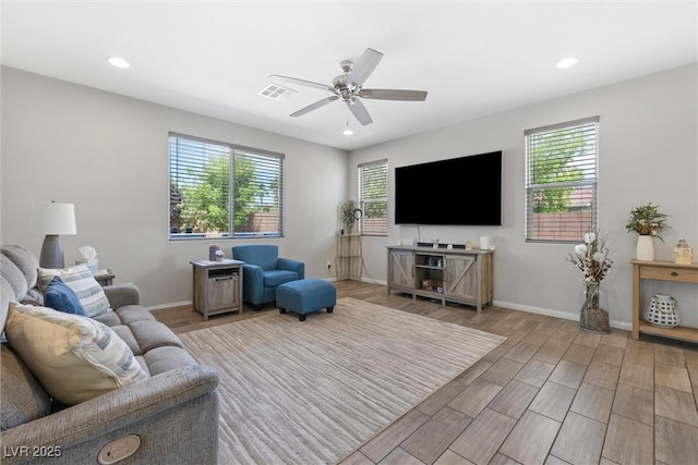 6783 Pleasant Flower St, Las Vegas, NV 89149 - living room with light wood-style floors, ceiling fan, recessed lighting, and baseboards