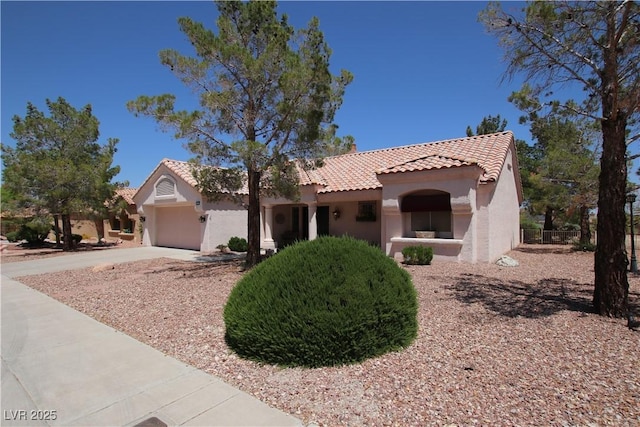 2820 Bluff Point Dr, Las Vegas, NV 89134 - view of front of house with a tile roof, stucco siding, concrete driveway, and a garage