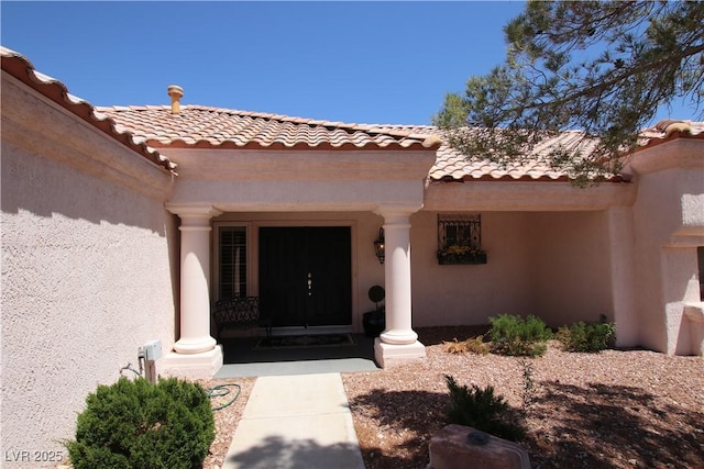 2820 Bluff Point Dr, Las Vegas, NV 89134 - entrance to property with a tile roof, stucco siding, and a porch