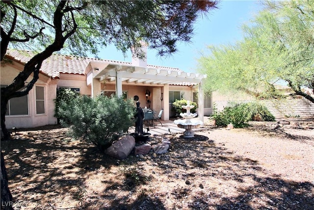 2820 Bluff Point Dr, Las Vegas, NV 89134 - back of house featuring a pergola, a tiled roof, a chimney, stucco siding, and a patio