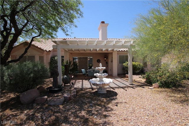 2820 Bluff Point Dr, Las Vegas, NV 89134 - rear view of property with a pergola, a patio area, a chimney, stucco siding, and a tiled roof