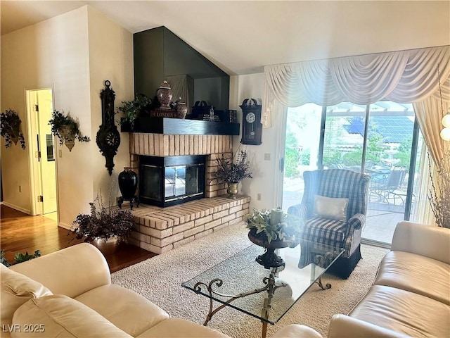 2820 Bluff Point Dr, Las Vegas, NV 89134 - living area with wood finished floors, a brick fireplace, and baseboards